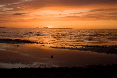 Sunset on the beach Stock Photos