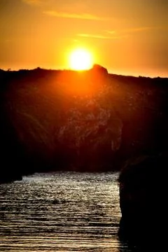 Sunset on a beach Stock Photos