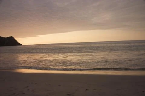 Sunset at the beach Stock Photos