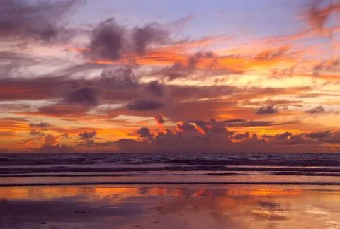 Sunset at the beach Stock Photos