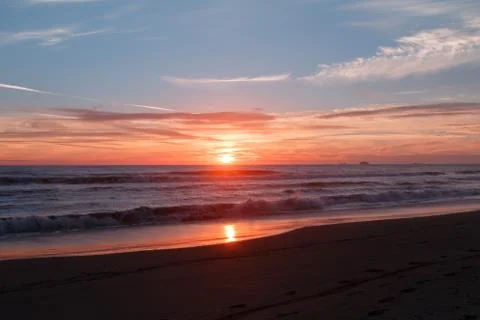 Sunset at the beach Stock Photos