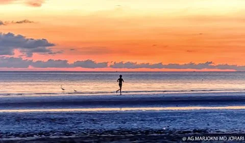 Sunset at the beach Stock Photos