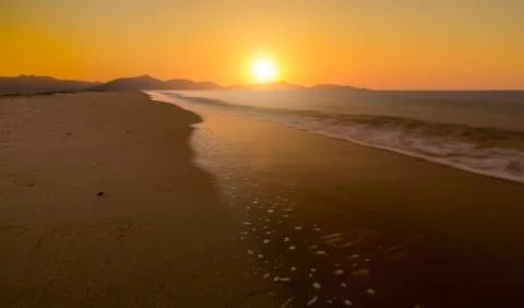 Sunset by the beach Stock Photos