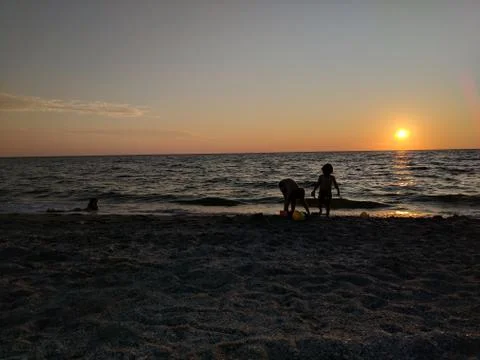 Sunset at the beach Stock Photos