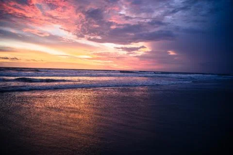 Sunset on the beach Photos