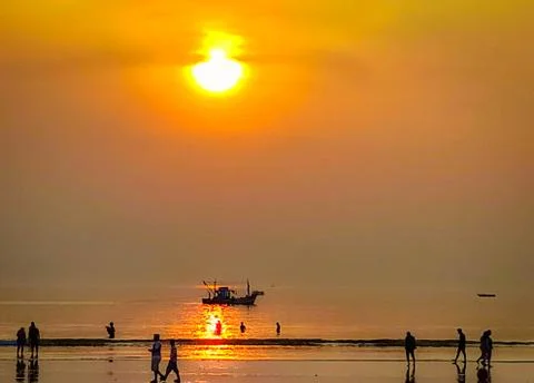 Sunset by the beach Photos