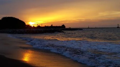 Sunset in the beach Stock Photos