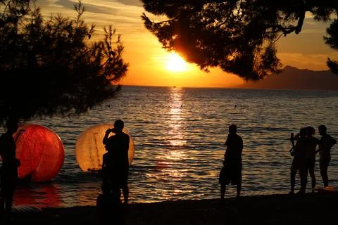 Sunset on a beach Stock Photos