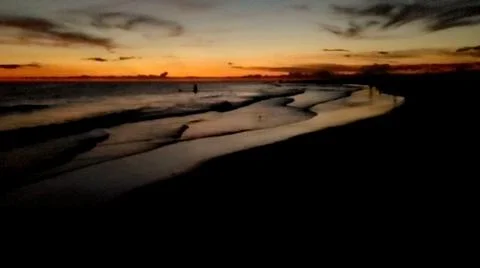 Sunset at the beach Stock Photos