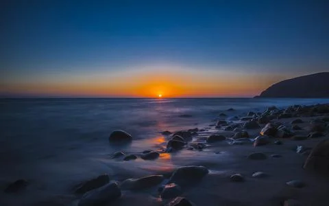 SUNSET AT THE BEACH Stock Photos