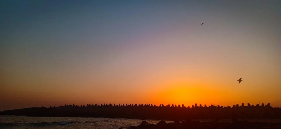 Sunset at the beach Stock Photos