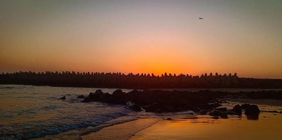 Sunset at the beach Stock Photos