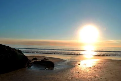 Sunset at the beach Stock Photos