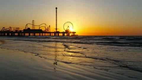 Sunset at the beach with a pier Stock Footage 312536891