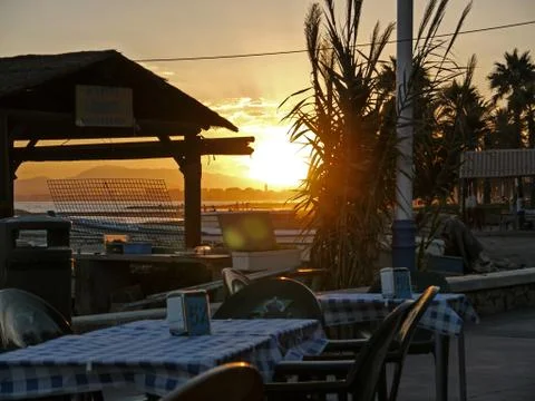 Sunset at a beach restaurant Stock Photos