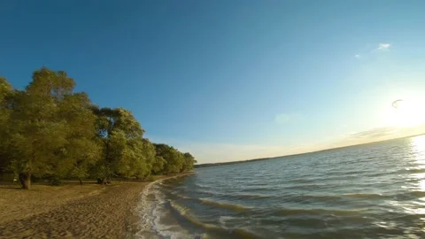 Sunset, beach, sand, wind, waves, water, sea, autumn, evening, sky, drone flight Video stock 160893610