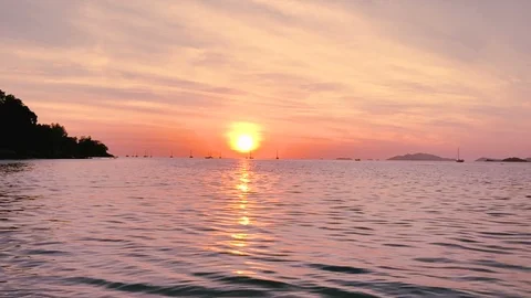 Sunset on the beach scene of a golden sunset over the sea Stock Footage 86846858
