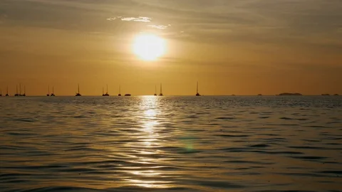 Sunset on the beach scene of a golden sunset over the sea Stock Footage 104236089