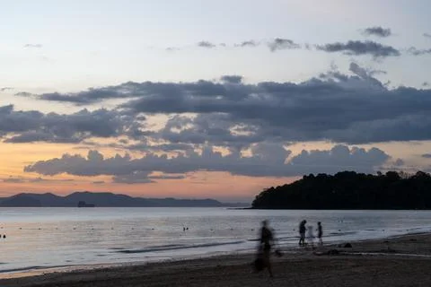 Sunset beach shoreline with clouds at Klong Muang Beach Thailand Stock Photos