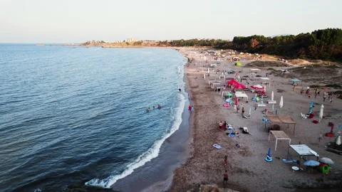 Sunset Beach Shoreline FPV Flight Just Over Waves Stock Footage 235658760