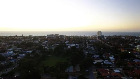Sunset beach side residential suburb Scarborough tracking aerial footage Stock Footage 101241204
