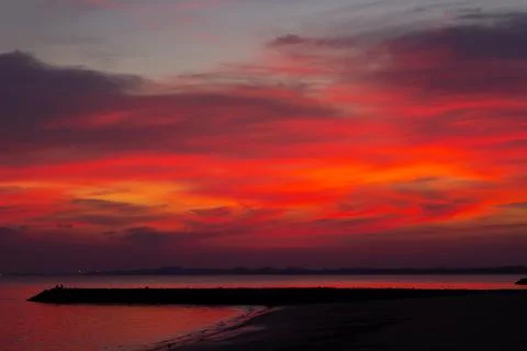 Sunset beach silhouette free styles holiday, water  sky and people. Stockfoto's