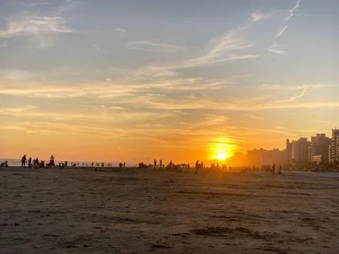 Sunset Beach with Silhouetted Crowd 스톡 사진
