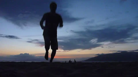 Sunset Beach Silhouettes 4 Running Man Towards Ocean Stock Footage 23799296
