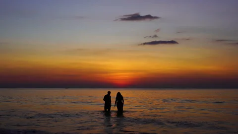 Sunset beach silhouettes of people. Stock Footage 208645473