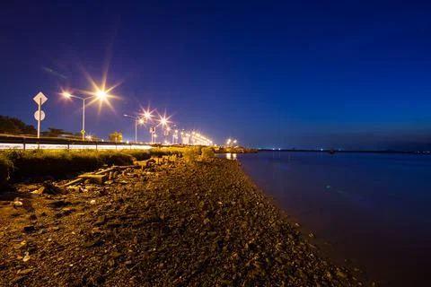 Sunset on beach with stone foreground Stock Photos