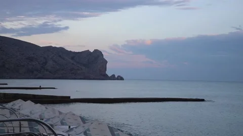 Sunset on the beach in Sudak Stock Footage 141382976