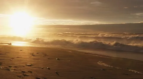 Sunset at a beach with surf Stock Footage 8630434