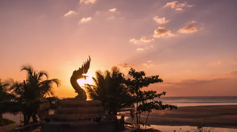 Sunset Beach Time Lapse with Dragon Statue Stock Footage 58656423