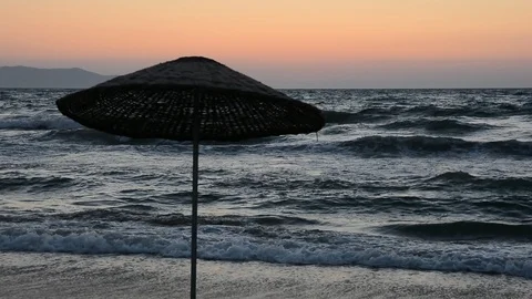 Sunset on beach umbrellas Stock Footage 114191197