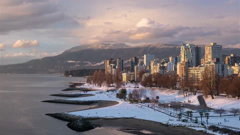 Sunset Beach in Vancouver evening time lapse after a snowfall Stock Footage 149330502