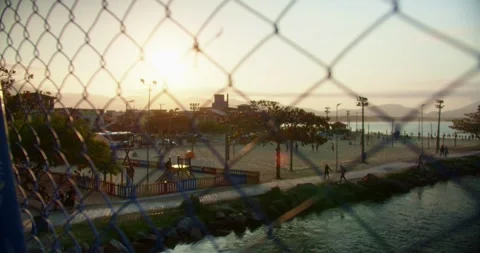 Sunset on the Beach With a View of the Bridge Stockbeeldmateriaal 247460685