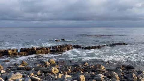 Sunset Beach View of the Pacific Ocean and Storm Clouds Overlooking Natural Reef Stock Footage 244094099
