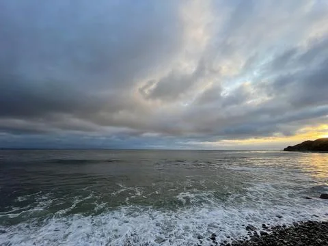 Sunset Beach View of the Pacific Ocean and Storm Clouds Overlooking Natural Reef Photos