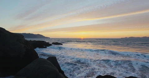 Sunset by the beach with waves clashing Video stock 69260083