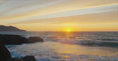 Sunset by the beach with waves clashing Video stock 69260346