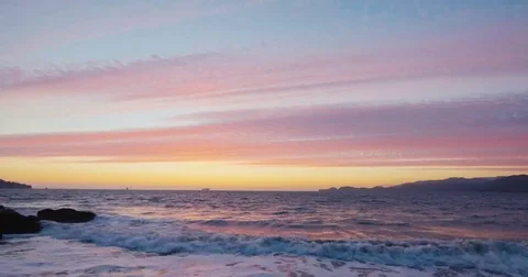 Sunset by the beach with waves clashing Video stock 69268354