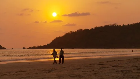 Sunset, beach, wide shot, orange sky, sea, Goa India, Beautiful Stock Footage