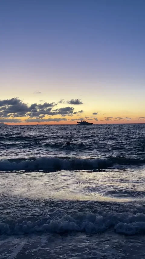 Sunset on the beach yellow and blue colors, tranquility and peace Stock Footage 248579074