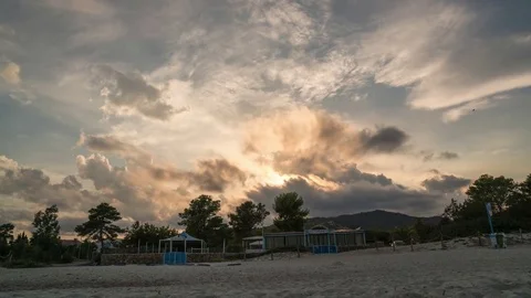 Sunset at the beach.Orange  clouds moving different directions Stock Footage 81142269