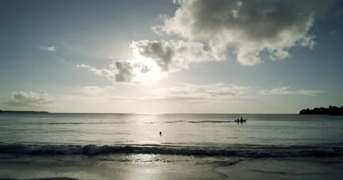 Sunset Beach/Small Boat Passing 4K Stock Footage 152865379