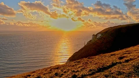 Sunset at Beachy Head with Lighthouse Stock Footage 228861190