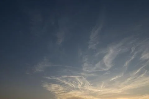 Sunset on a beautiful blue cloudy sky Stock Photos