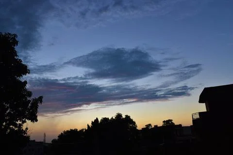 Sunset with beautiful clouds in sky background Stock Photos