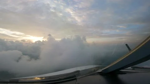Sunset beautiful clouds view from cockpit plane Stock Footage 230173837