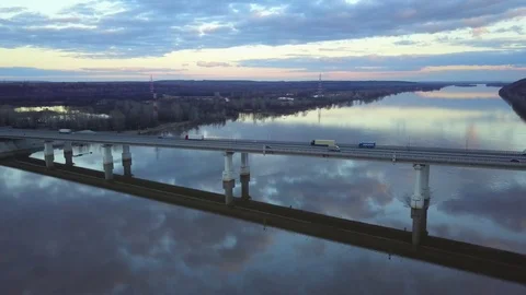 Sunset beautiful colors reflect in the river with crossing bridge Stock Footage 122361490